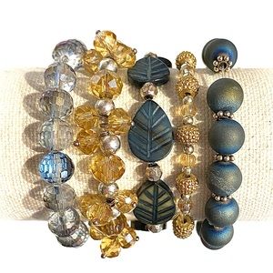 5 strand beaded multilayered stretch bracelets in a denim color and gold.